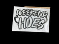 Cardboard box with a 'Weekend Hoes' sticker on a reflective surface